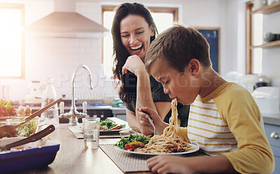 Buy stock photo Happy woman, child and eating pasta with kitchen table, meal and food for dinner, holiday or vacation. Excited, people and hungry as family, mom and kid for nutrition, bonding and spaghetti in home