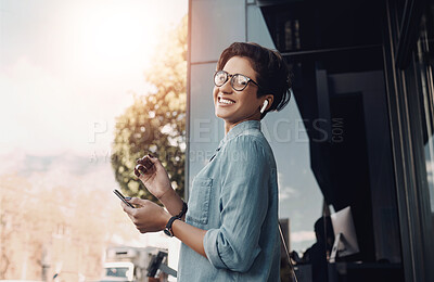 Buy stock photo Woman, happy and portrait in city with music, phone and streaming new album on platform. Freelancer, smile and mobile at building with earphones, freedom and enjoy favorite song on urban commute