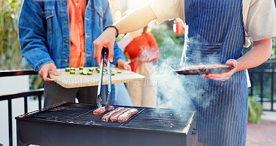 Buy stock photo Barbecue, food and friends with sausage outdoor backyard for meal at reunion, social event or lunch on terrace. Grill, party and men cooking meat and vegetables for bbq dish on weekend at home.