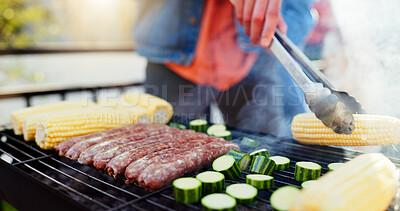 Buy stock photo Grill, food and man with sausage and vegetables outdoor backyard for meal at reunion, social event or lunch. Barbecue, party and male person cooking meat and produce for bbq dish on weekend at home