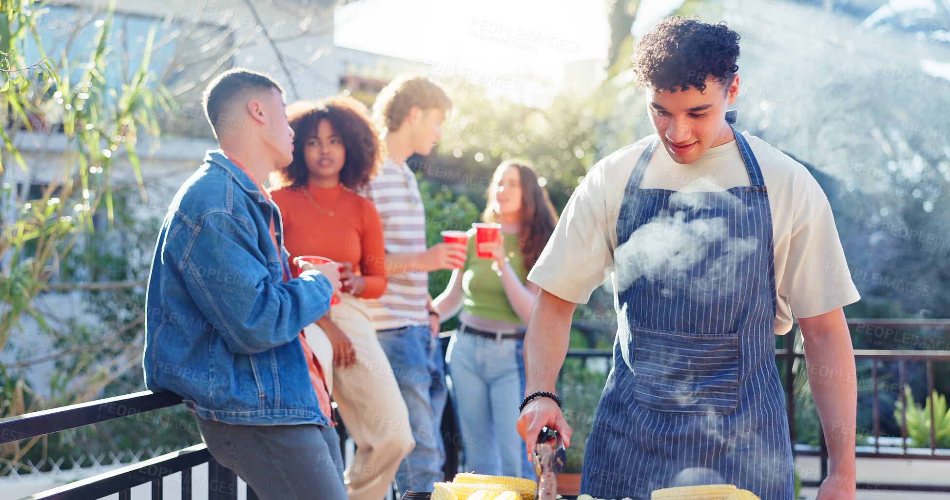 Buy stock photo Barbecue, party and friends on outdoor backyard for meal at reunion, social event or lunch on terrace. Grill, food and young people cooking, drinking and bonding together for bbq dish for celebration