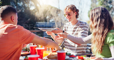 Buy stock photo Friends, people and eating bbq outdoor on terrace with conversation, reunion and social event in summer. Group, barbecue and lunch on patio with food, talking and celebration with bonding and drinks