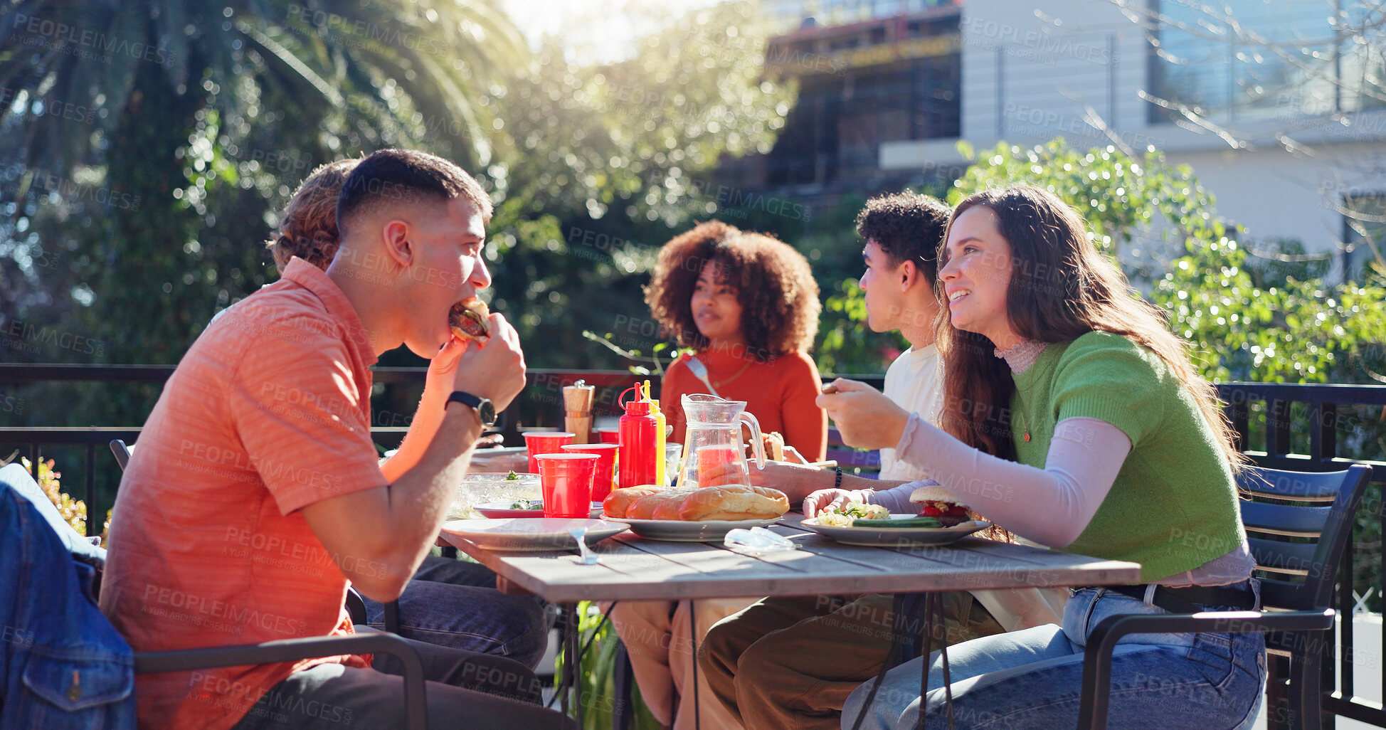 Buy stock photo Friends, people and eating bbq outdoor on terrace with conversation, reunion and social event in summer. Group, barbecue and lunch on patio with food, talking and celebration with bonding and drinks