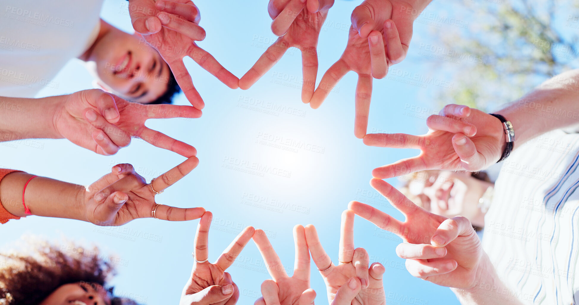 Buy stock photo Friends, people and group with star or below for teamwork, peace and support with blue sky outdoor. Hand shape, team building and solidarity for collaboration, partnership and motivation with fingers