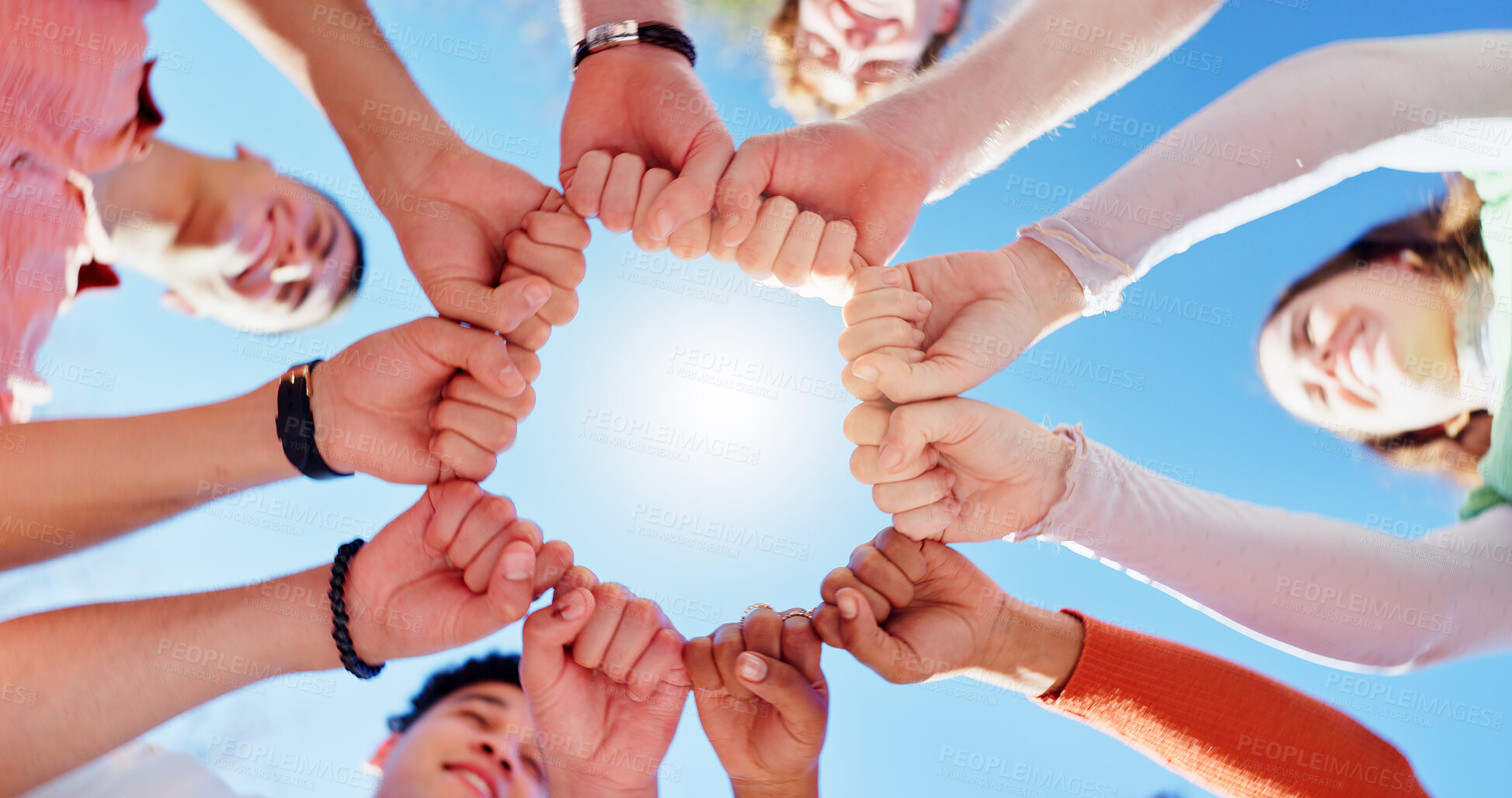 Buy stock photo Friends, people and group with fist bump or below for teamwork, unity and support in circle outdoor. Hands, team building and solidarity for collaboration, partnership and motivation with diversity