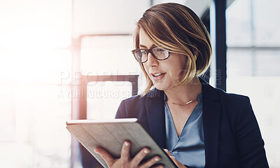 Buy stock photo Business woman, research and reading with tablet for news, data or study on corporate development at office. Young female person or employee with glasses on technology for company overview or report