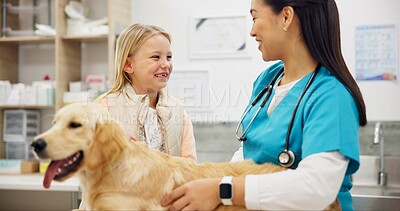 Buy stock photo Woman, vet and dog at clinic with child, consulting and stroke for health, development and growth with wellness. People, doctor and golden retriever pet with smile, talk and exam at animal hospital