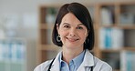 Woman doctor, smile and confident in portrait for medical, medicare or healthcare in clinic. Female person, pride and happy in office for service, support and specialist or consultant in workplace