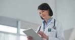 Reading, woman and tablet in office, doctor and medical diagnosis online, healthcare and hospital. Clinic, stethoscope and employee with uniform, medicine and smile for notes, typing and schedule