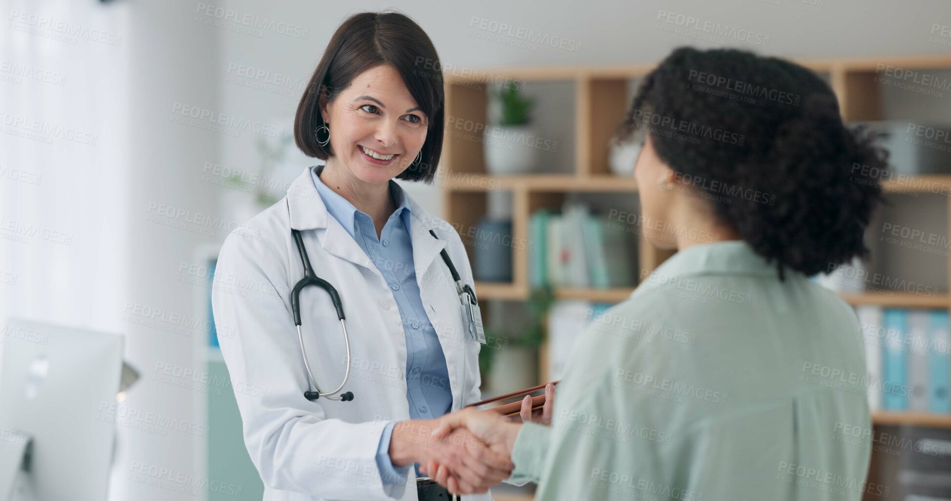 Buy stock photo Healthcare, hello or girl and doctor with handshake in office for surgery, agreement or support. Hospital, service and client shaking hands with surgeon for medical plan, approval or treatment trust