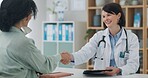 Healthcare, tablet or girl and doctor with handshake in office for surgery, agreement or support. Hospital, service and client shaking hands with surgeon for digital plan, approval or treatment trust