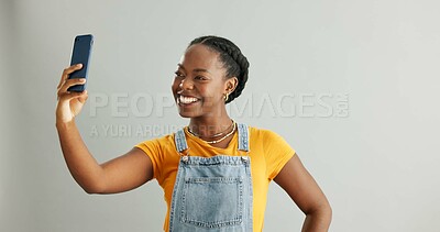 Buy stock photo Woman, selfie and happy in studio with smartphone, photography and social media update with tech communication. Influencer, mobile app and confident for profile picture, smiling and blog post