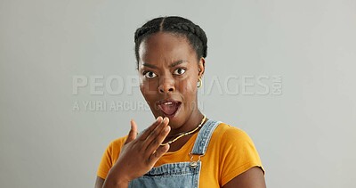 Buy stock photo Shocked, portrait and black woman in studio with wow for announcement, gossip or fake news on gray background. Wtf, mockup and person with hand covering mouth for secret, omg or unexpected revelation