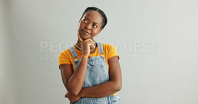 Buy stock photo Black girl, studio and thinking of ideas for problem solving or planning, insight and brainstorming for decision. Woman, thoughtful and isolated on white background with mockup, pensive and choice.