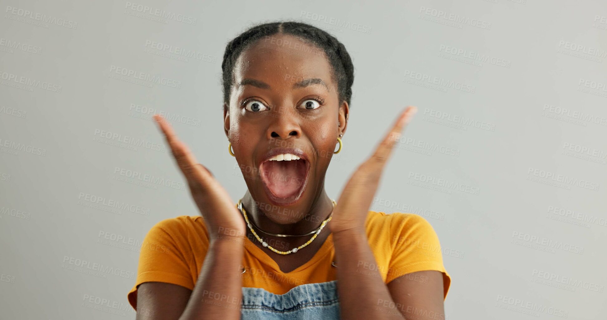 Buy stock photo Surprised, portrait and black woman in studio with wow for announcement, gossip or good news on gray background. Wtf, mockup and person with hands covering face for secret, omg or discount reaction