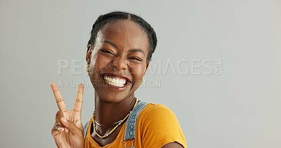 Buy stock photo Portrait, peace sign and black woman with smile, support and motivation on grey studio background. African person, face and model with hand gesture, v symbol and excited with icon, feedback or review