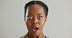 Portrait, surprised and black woman in studio with omg for announcement, gossip or fake news on gray background. Open mouth, emoji and person with reaction for secret, wtf or unexpected revelation