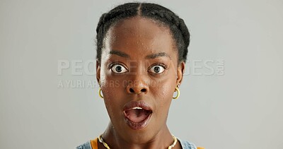 Buy stock photo Portrait, surprised and black woman in studio with omg for announcement, gossip or fake news on gray background. Open mouth, emoji and person with reaction for secret, wtf or unexpected revelation