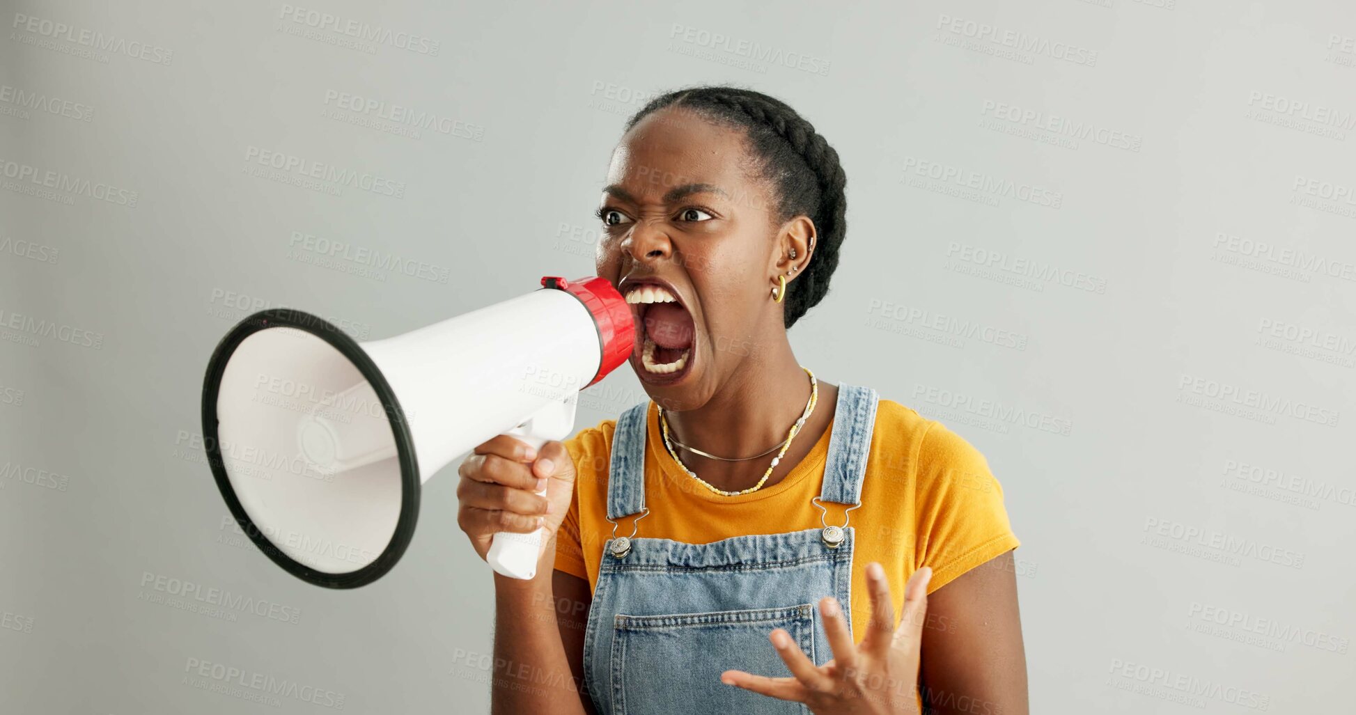 Buy stock photo African woman, bullhorn and protest in studio with shouting, anger and announcement by white background. Gen z girl, student and activism with megaphone for human rights, justice or accountability