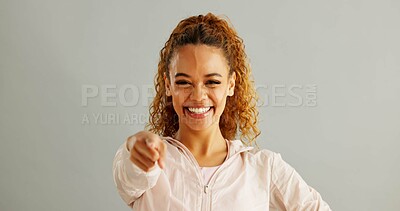 Buy stock photo Portrait, smile and woman in studio pointing to you for opportunity, decision or selection on gray background. Vote, winner and person with hand gesture for option, choice or invitation on mockup