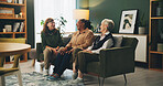 Senior women, friends and laugh on sofa with funny story, memory or gossip with bonding in retirement. People, relax and conversation with smile, care or connection on couch in lounge at nursing home