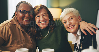 Buy stock photo Happy, hug and portrait of senior women in house with care, trust and support, relax and bonding with coffee. Smile, face or elderly friends embrace in retirement home for reunion, visit or tea party