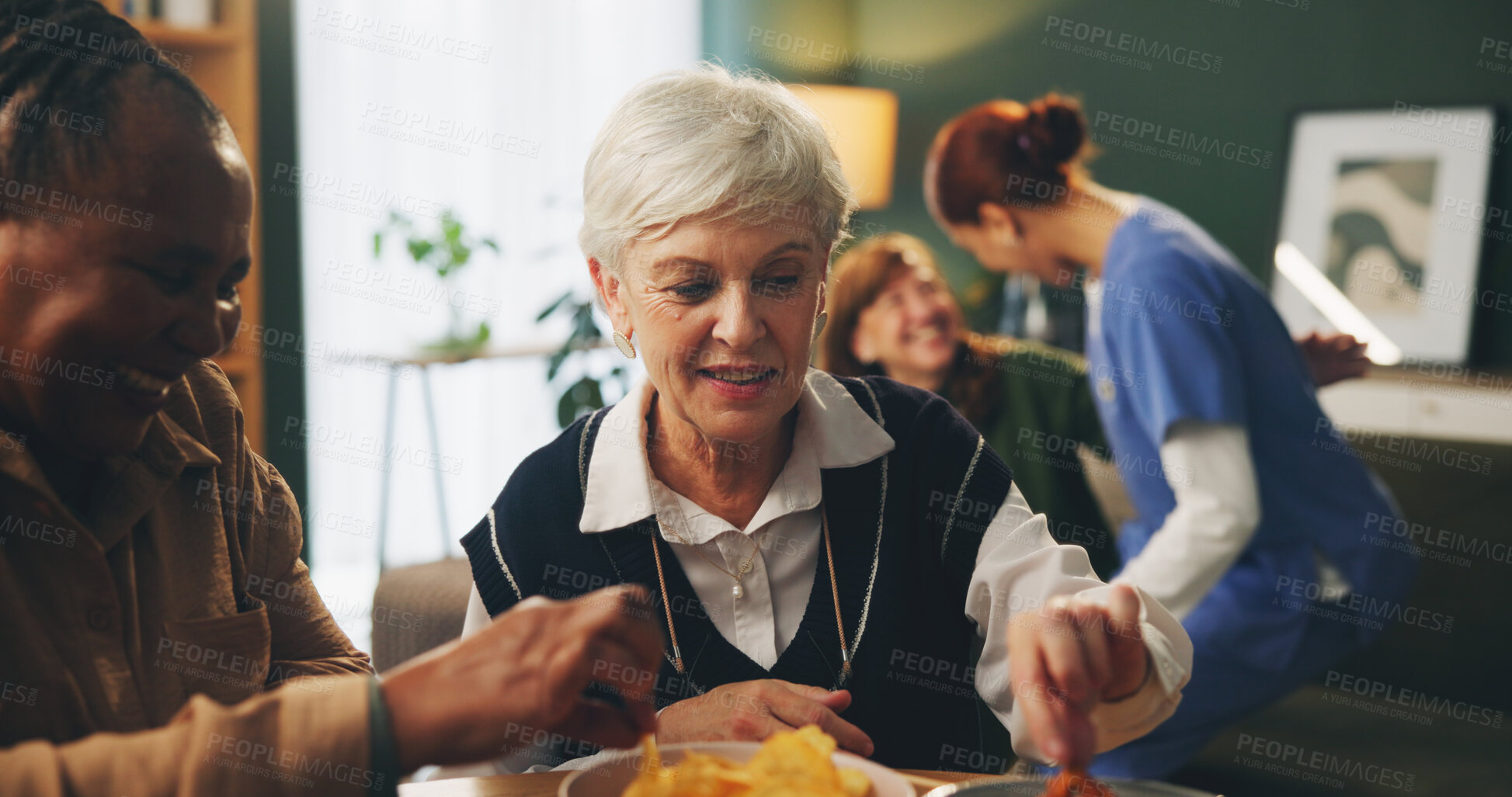 Buy stock photo Senior women and retirement with eating in home with conversation, bonding and wellness with snacks. Elderly, people and friends in living room with chips for relax, support and happy at dinner table