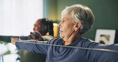 Buy stock photo Fitness, stretching and senior woman with band in home for exercise, training and workout in living room. Retirement, sports class and people with equipment for wellness, healthy body and cardio