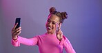 Woman, selfie and peace sign in studio with smile, fashion and makeup for post by purple background. Influencer, girl and happy for audience growth with icon, emoji or profile picture on social media
