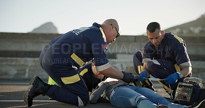 Buy stock photo Paramedic, rescue and team with patient, outdoor and EKG to check heart, service and helping of person. EMS, accident and injury on street, healthcare and medical professional with victim in USA