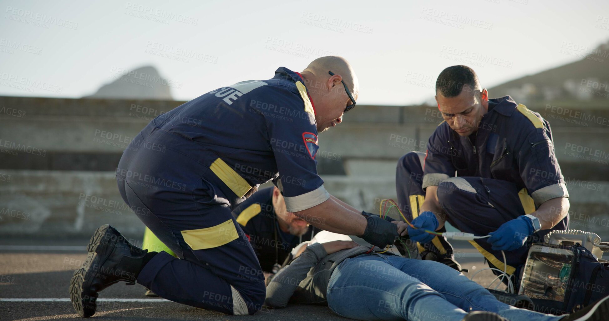 Buy stock photo Paramedic, rescue and team with patient, outdoor and EKG to check heart, service and helping of person. EMS, accident and injury on street, healthcare and medical professional with victim in USA