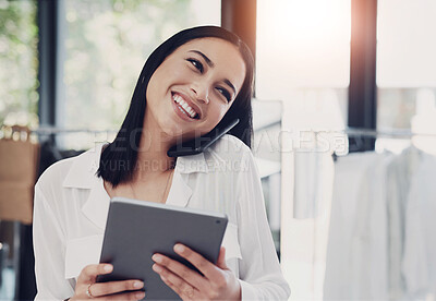 Buy stock photo Shot of a young business owner talking on her cellphone while using a digital tablet in her store