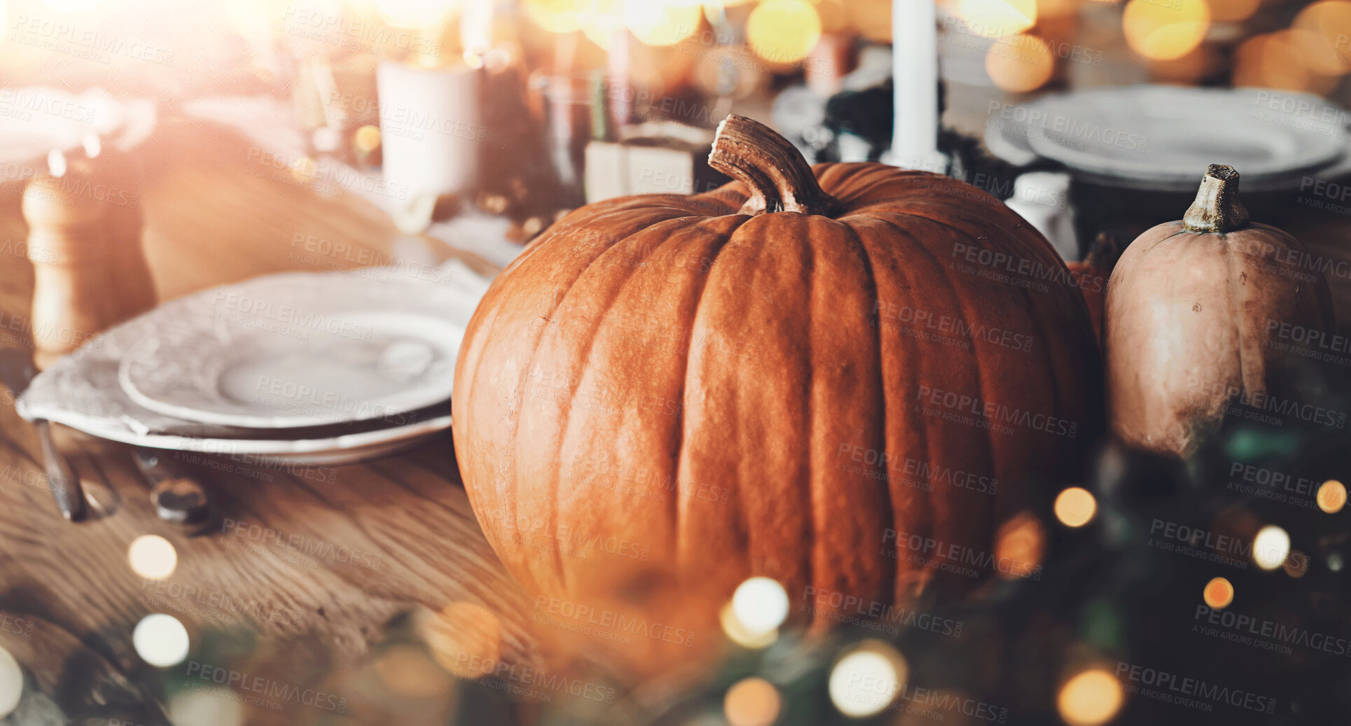 Buy stock photo Table, setting and celebration with pumpkin for thanksgiving, festive holiday and tradition at home. Dinner, creativity and preparation with vegetable for inspiration, fall season and bokeh in house