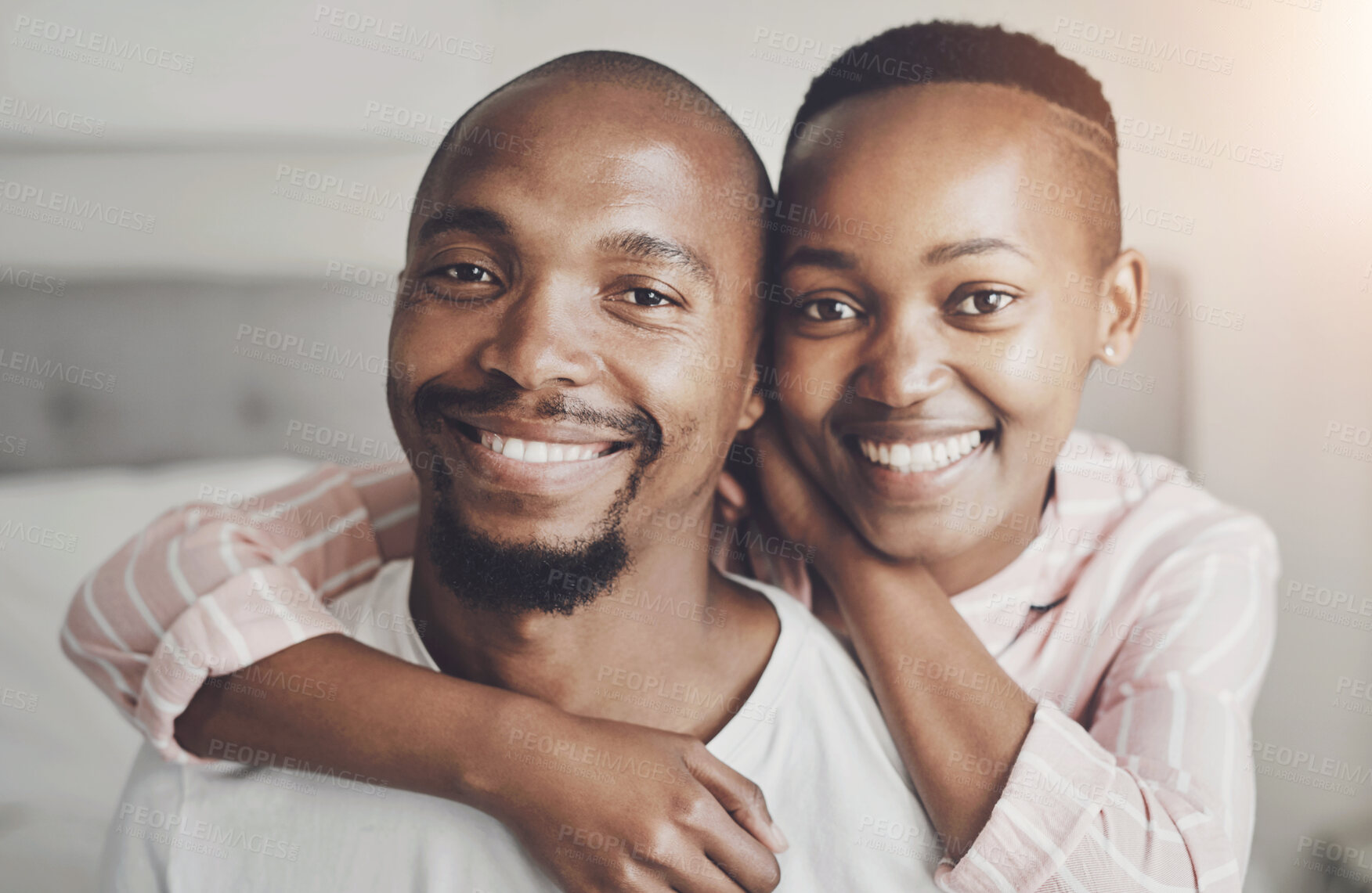 Buy stock photo Hug, happy and portrait of black couple on bed for bonding, relationship and relax in home. Marriage, morning and man and woman with embrace for care, commitment and affection in bedroom for love