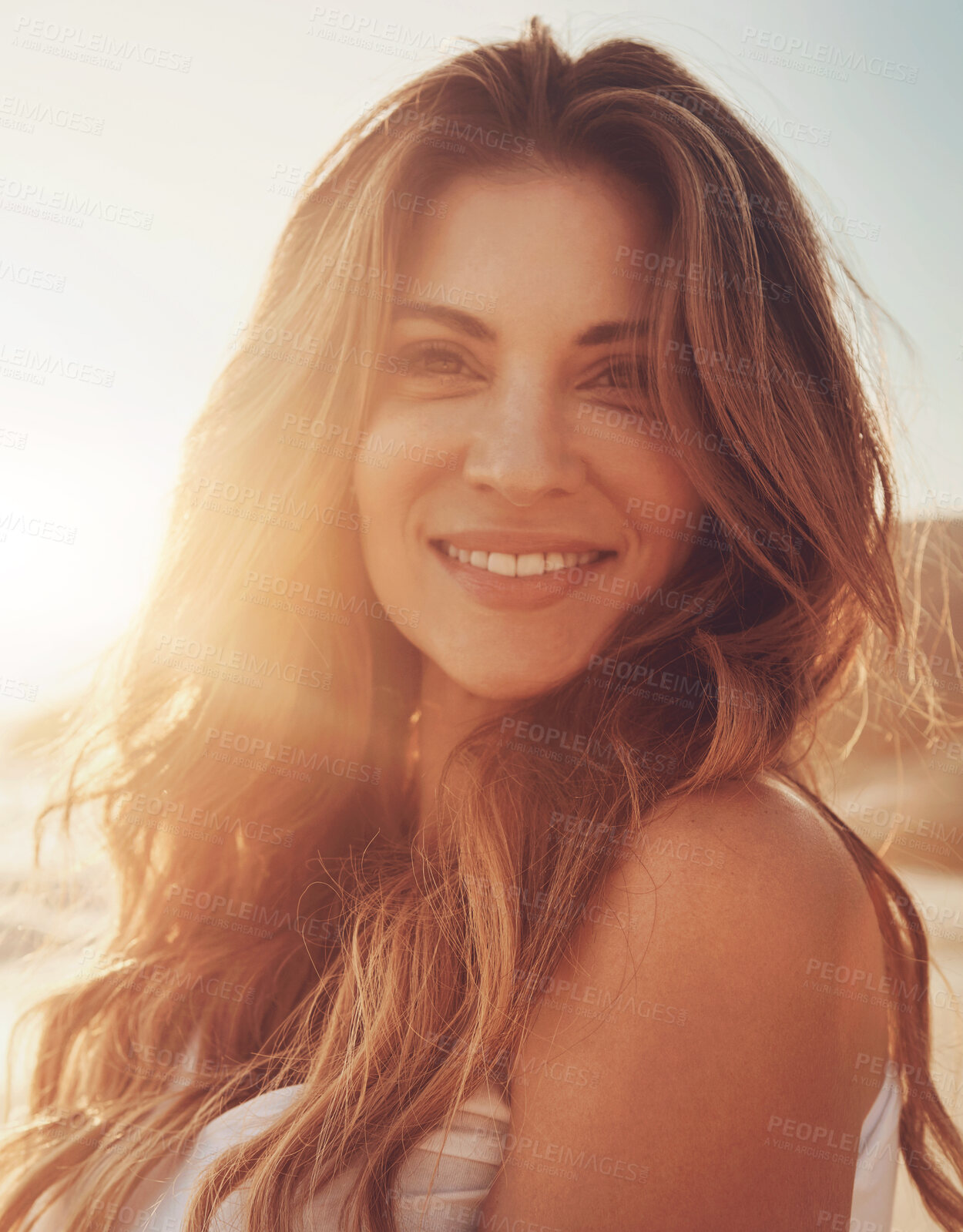 Buy stock photo Portrait of a young woman spending some time at the beach