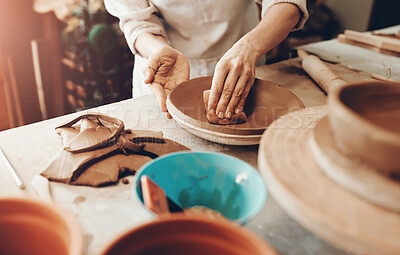 Buy stock photo Cropped shot of an unrecognizable artisan working in a pottery workshop