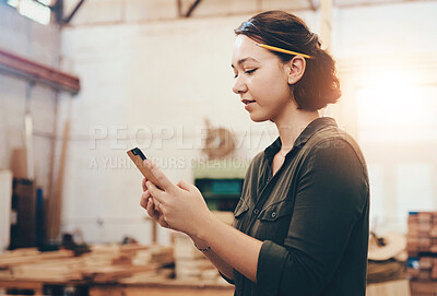 Buy stock photo Woman, phone and carpenter for communication in workshop, online and order supplies on app. Female person,  woodwork and check business review on internet, email client and plan furniture design
