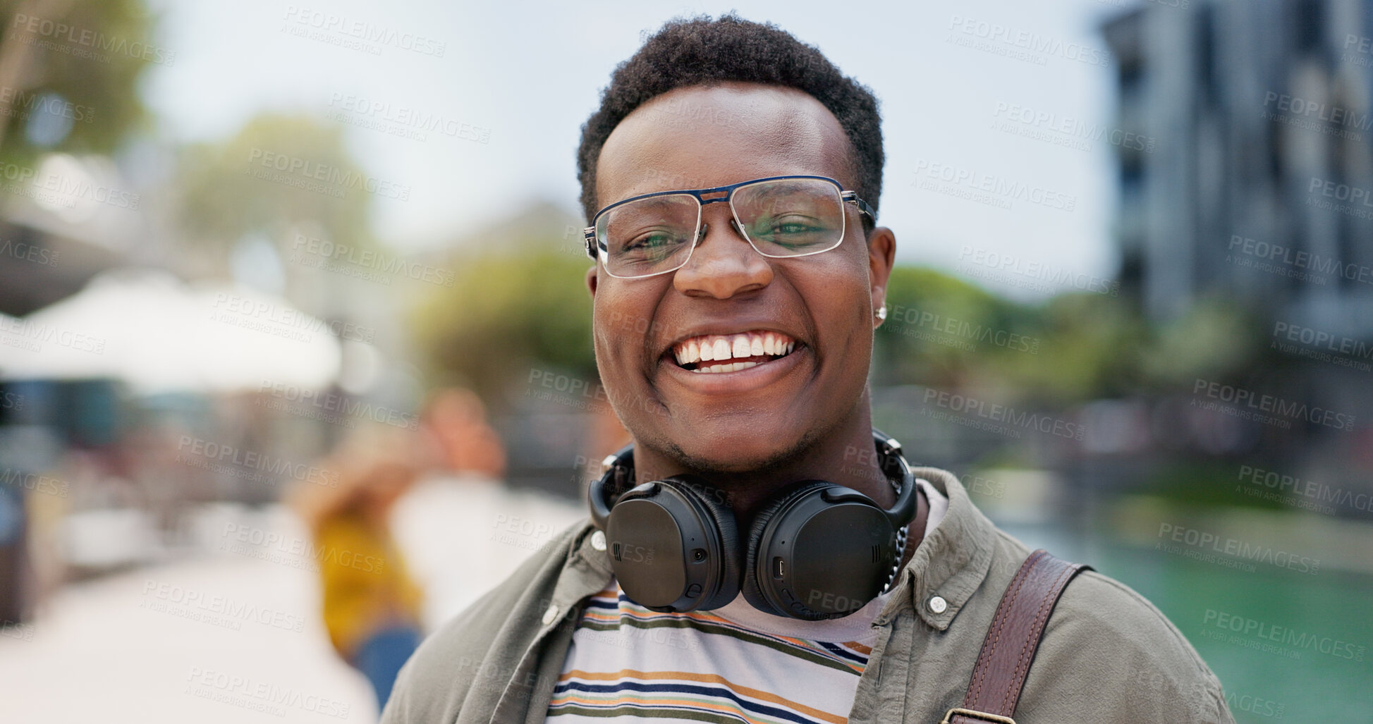 Buy stock photo Portrait, student and black man in city, happiness and break with adventure, headphones and education. Face, African person and college with guy, headset and walking with smile, travel and commute