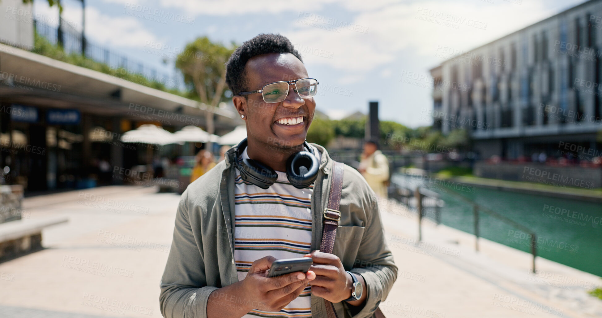 Buy stock photo Education, laughing and phone with student black man on campus of college or university for learning. Development, funny and music with happy person outdoor at school for growth, scholarship or study