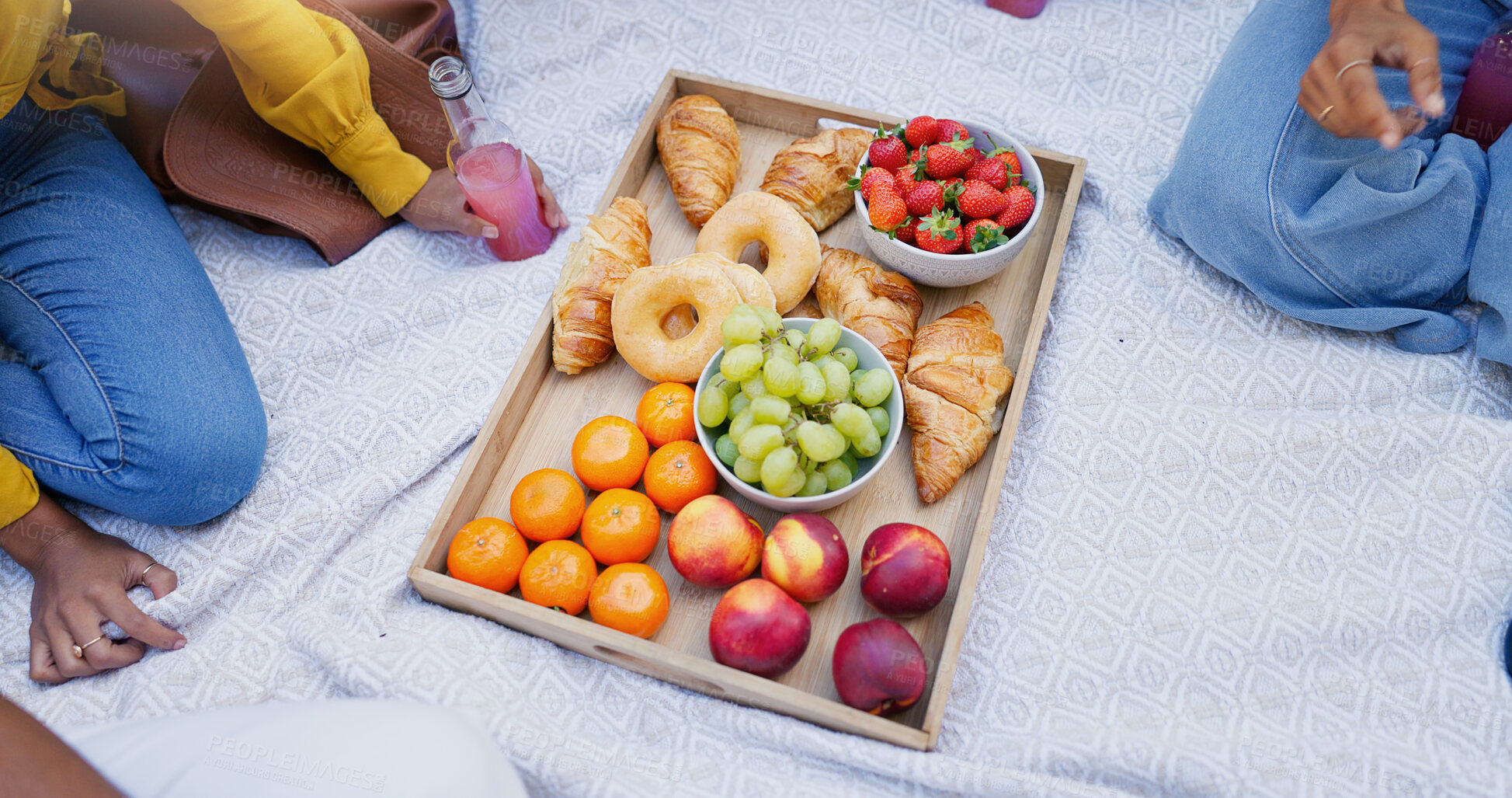 Buy stock photo People, blanket and picnic with fruit, top view and snack with nutrition, relax and bonding together. Closeup, group and friends with organic food, delicious and outdoor with croissant or charcuterie
