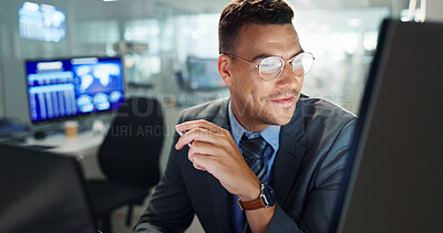 Buy stock photo Man, computer and night in office with trading, reading and review for results, information or stats on stock market. Person, employee and smile by pc for profit, growth or revenue at finance company