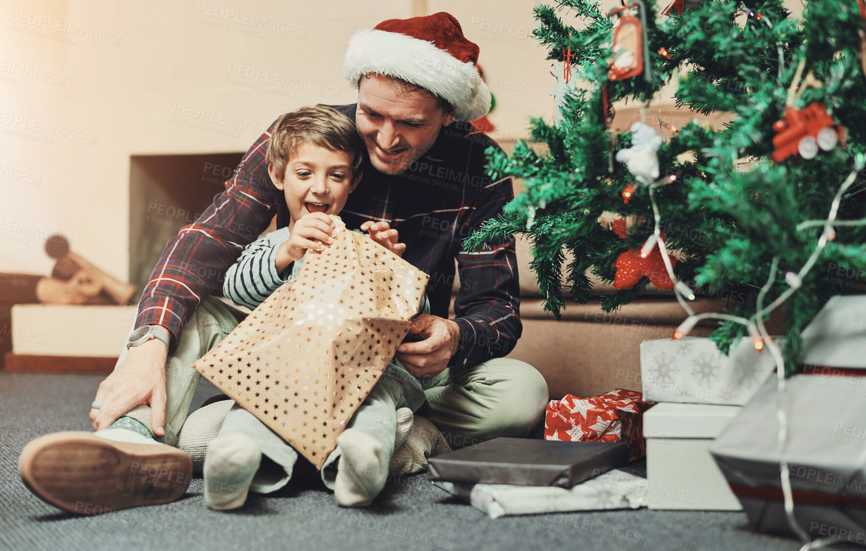 Buy stock photo Christmas, father and child with happiness for gift, tree for decoration with bonding and love in family home. Celebration, winter holiday and man with boy excited for present, xmas cheer and joy