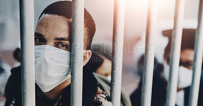 Buy stock photo Mask, portrait and virus with man in cage as isolation for outbreak or pandemic in urban town. Face, gate and social distancing with person behind bars for protection or safety from monkeypox