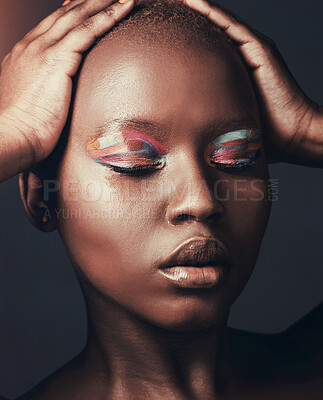 Buy stock photo Makeup, artistic and black woman with beauty, shine and cosmetics on dark studio background. African person, model and girl with creativity, skincare and glow with luxury,  aesthetic and eyeshadow