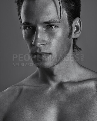 Buy stock photo Face, thinking and serious man in monochrome studio on gray background for masculine cosmetics. Beauty, skincare and shirtless with confident young model in black and white for artistic vision