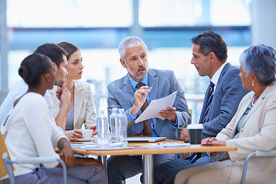 Buy stock photo A cropped shot of a diverse group of businesspeople having a meeting