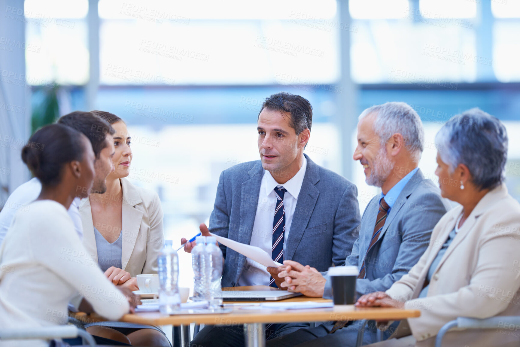 Buy stock photo A cropped shot of a diverse group of businesspeople having a meeting