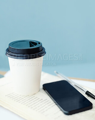 Buy stock photo Coffee, business newspaper and empty office with phone at work on background space at startup. Cup, drink or news journal on desk for paper report, document or pen for article in room interior design