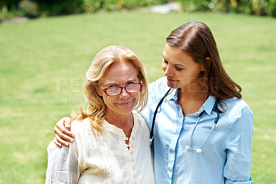 Buy stock photo Cropped shot of a young nurse comforting her senior partient