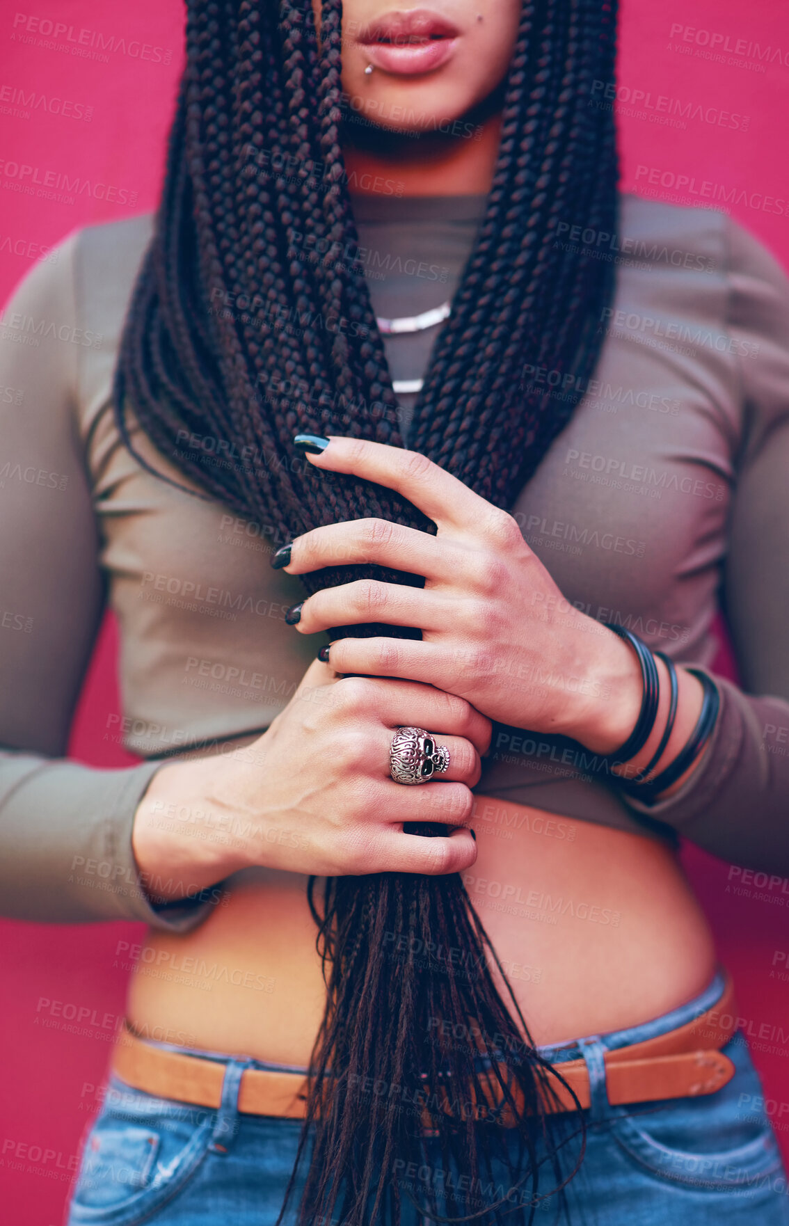 Buy stock photo Woman, hands and hair with braids, jewelry or cosmetics for fashion or beauty on a pink studio background. Closeup of young model or female person with long braided hairstyle, weave or extensions